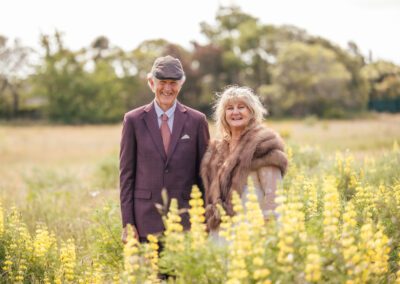 Wedding photo of George & Glenda portrait in flowery field
